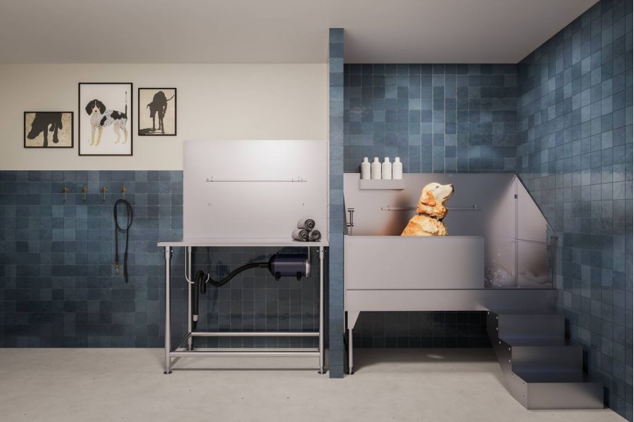 A yellow dog is being bathed in a modern blue-tiled pet grooming room with washing and drying stations.