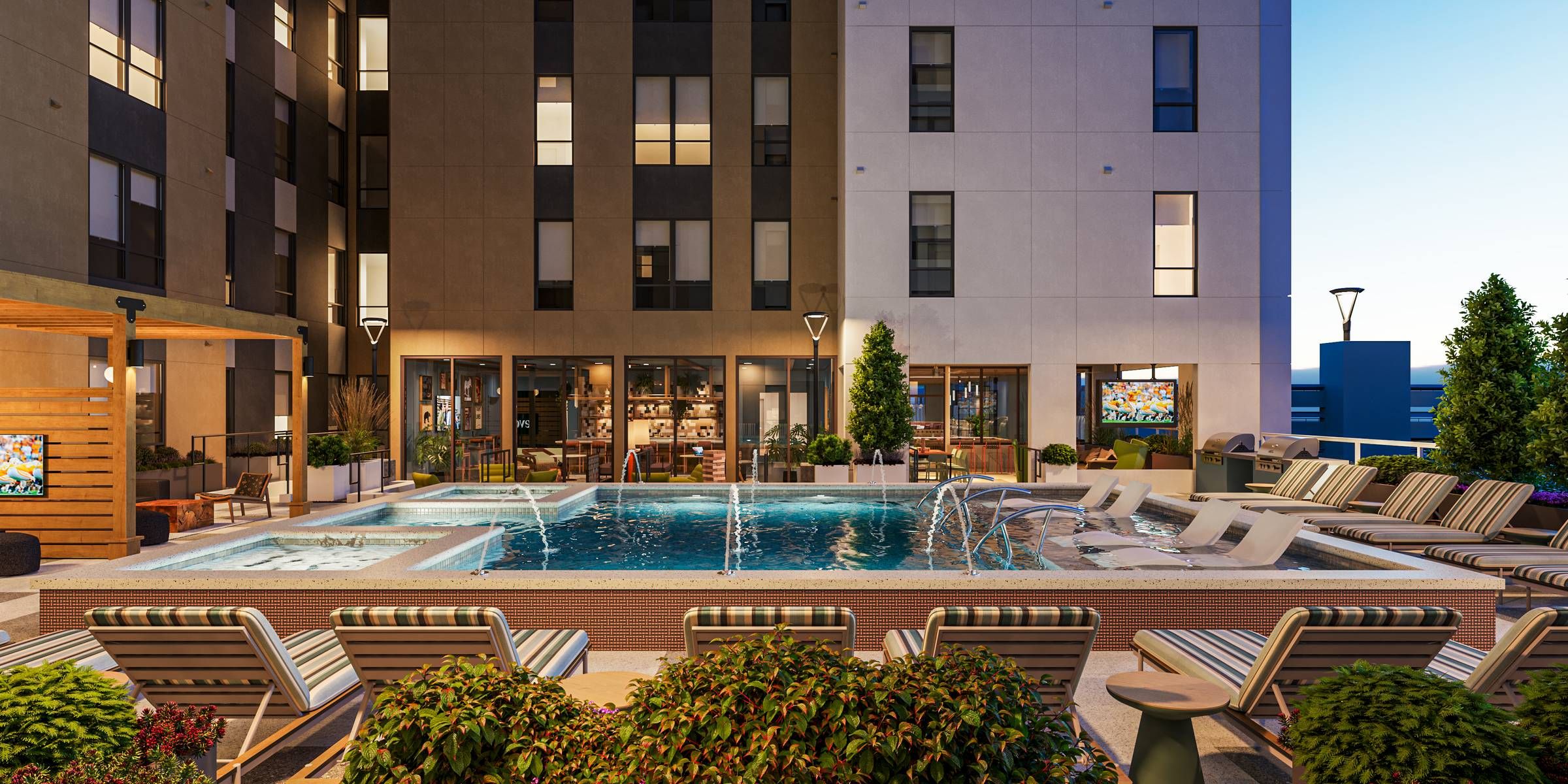 EVER Knoxville apartments pool courtyard with fountains and lounge seating
