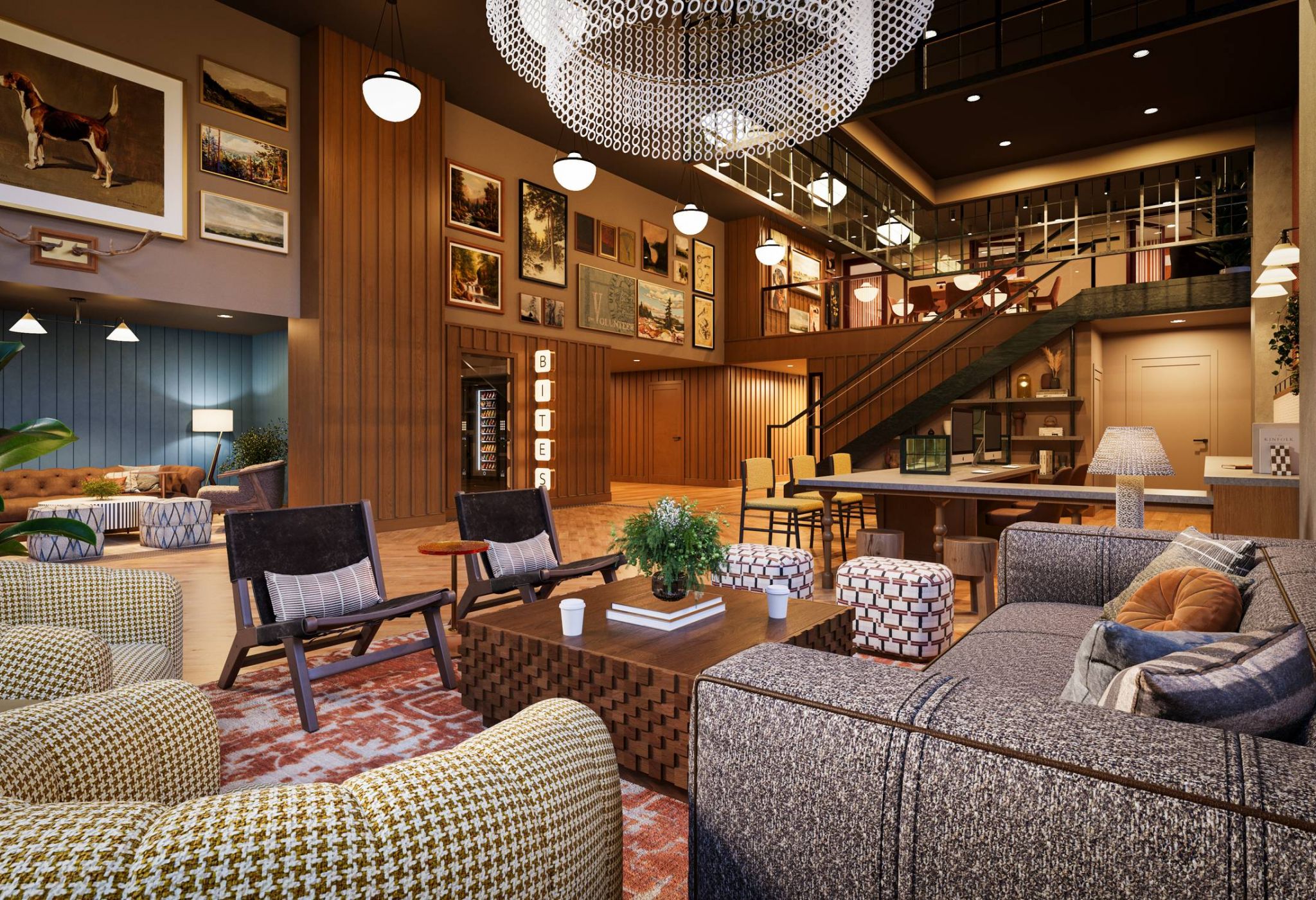 Modern, cozy lobby with stylish seating, art-filled walls, warm lighting, and a staircase in the background.
