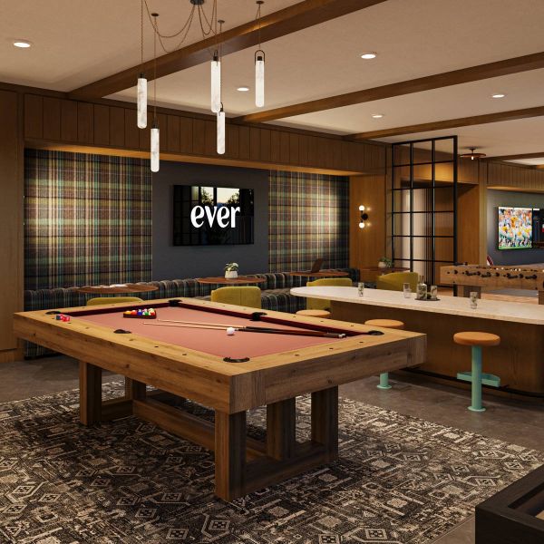 EVER Knoxville apartments Modern game room with a pool table, shuffleboard, TVs, bar seating, and plaid accent wall.