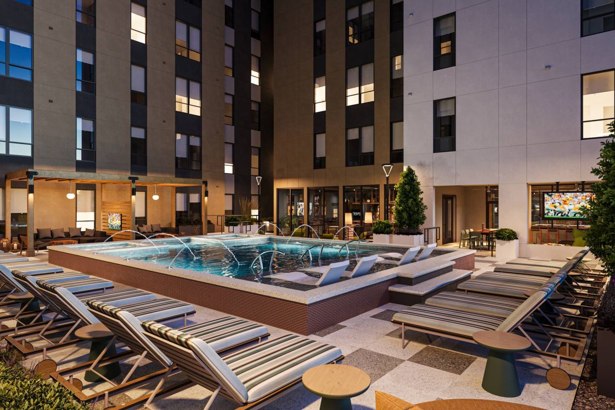 EVER Knoxville apartments pool courtyard with fountains and lounge seating