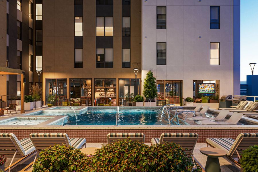EVER Knoxville apartments pool courtyard with fountains and lounge seating