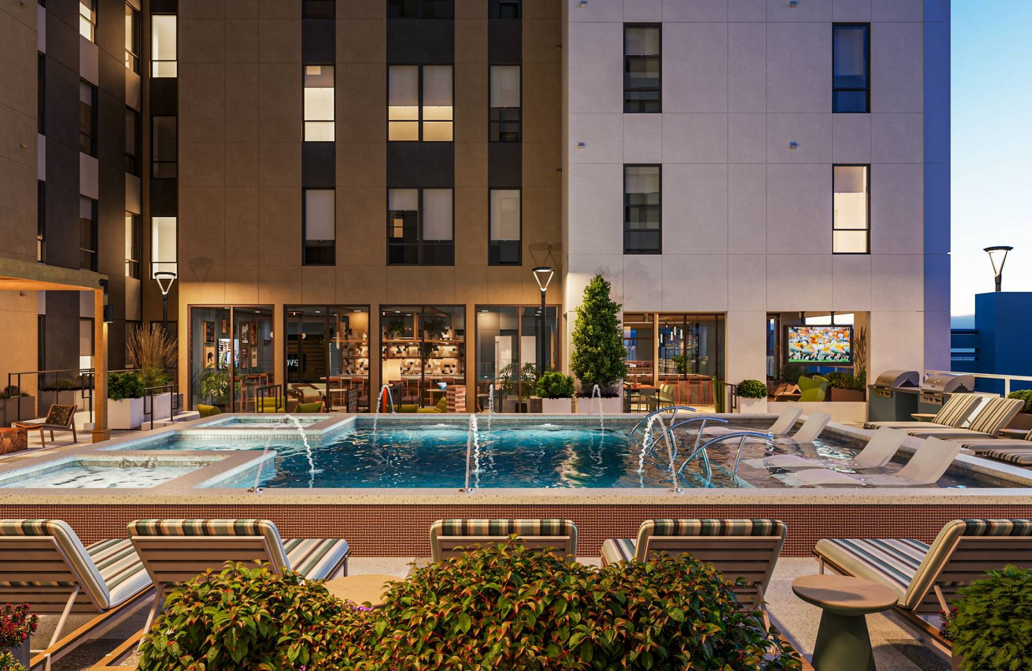 EVER Knoxville apartments pool courtyard with fountains and lounge seating