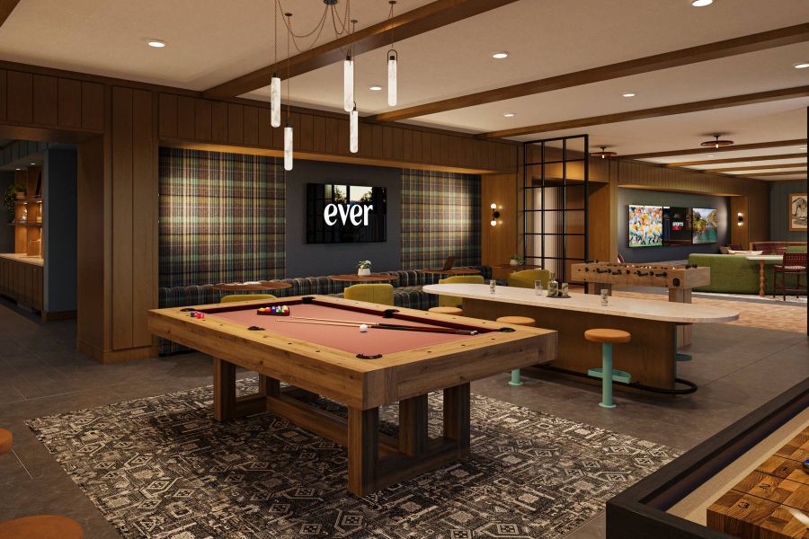 EVER Knoxville apartments Modern game room with a pool table, shuffleboard, TVs, bar seating, and plaid accent wall.
